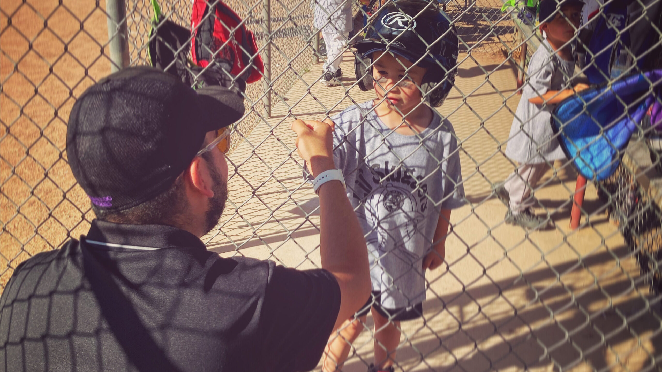 How To Choose The Right Sport For Your Child dad supporting a kid